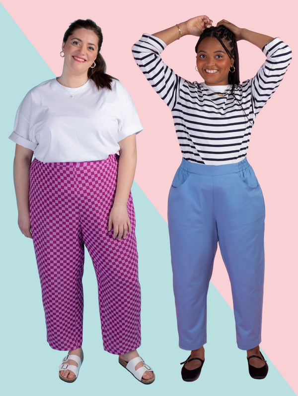 Two models wearing barrel leg trousers sewing pattern in pink check double gauze and blue cotton twill
